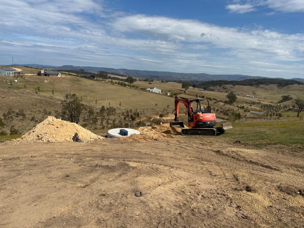 All Purpose Plumbing team placing a wastewater storage tank at a job site